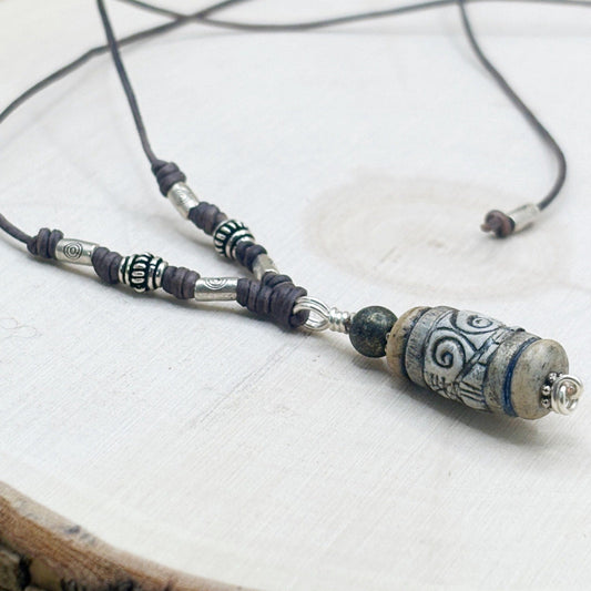 Necklace with beads on a light wood background-p