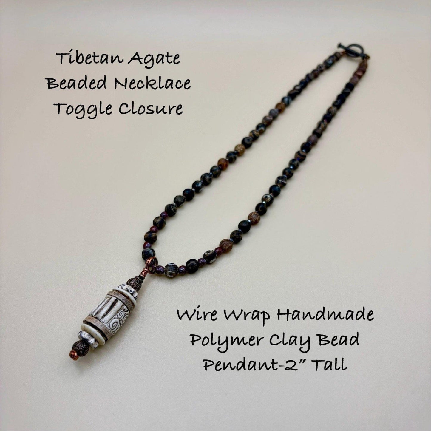 Tibetan Agate Beaded Necklace with Wire Wrap Handmade Polymer Clay Bead Pendant on a light background