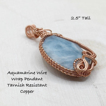 Aquamarine wire wrap pendant on a white background with text indicating size and material.