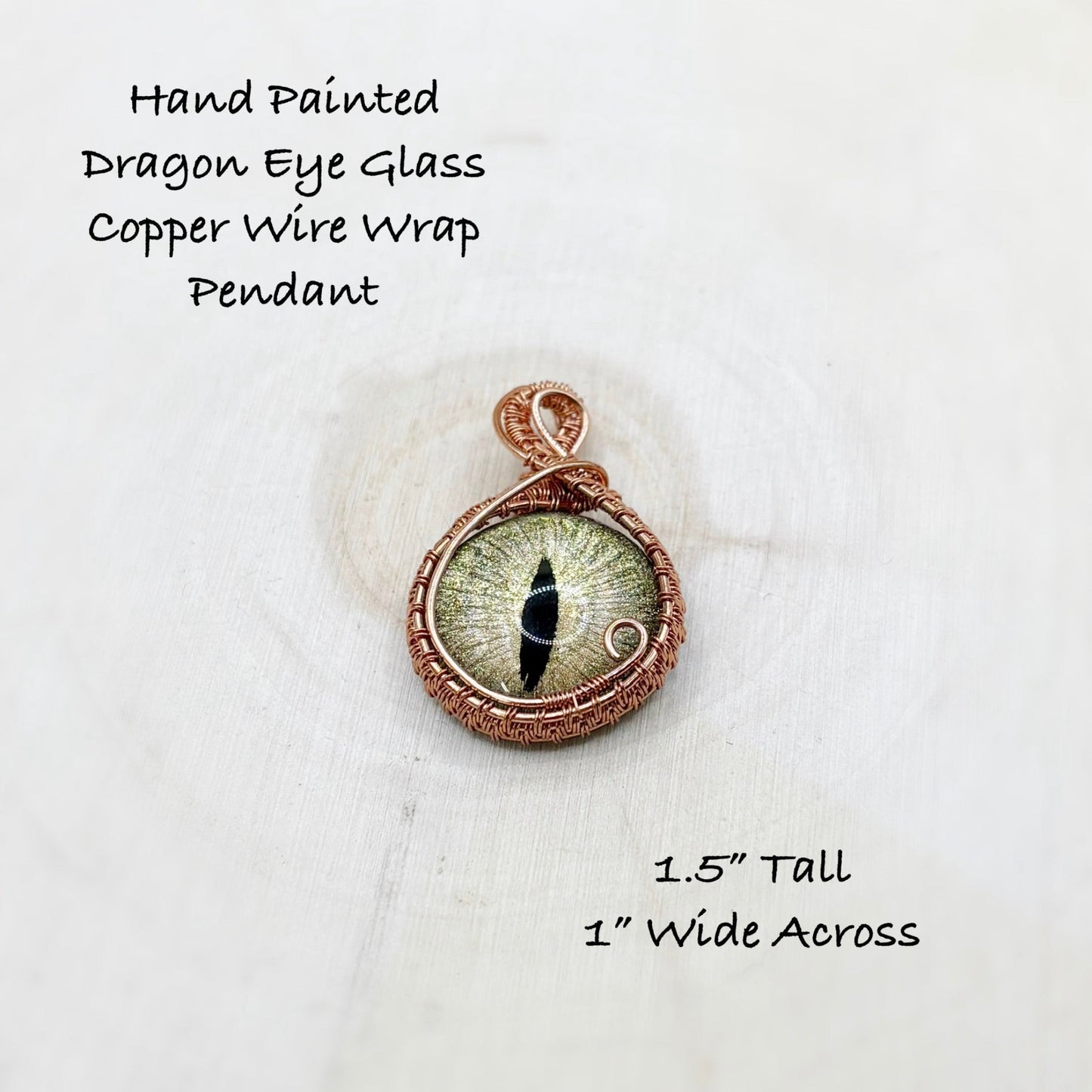 Hand painted dragon eye glass copper wire wrap pendant on a white background