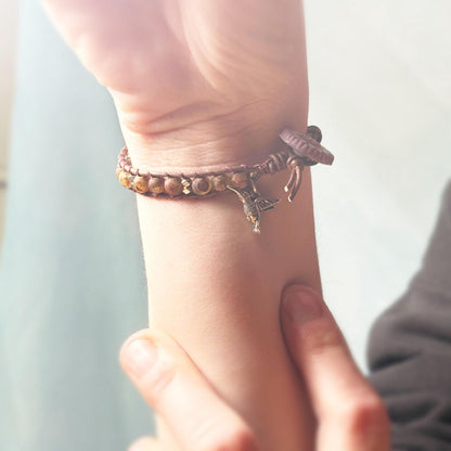 Close-up of a wrist with a bracelet on a blurred background