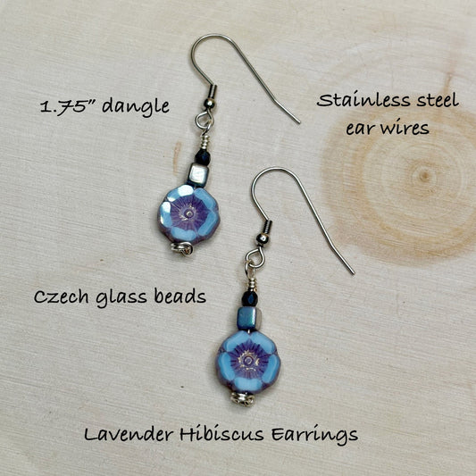 Lavender Hibiscus earrings with text on stainless steel ear wires and Czech glass beads.