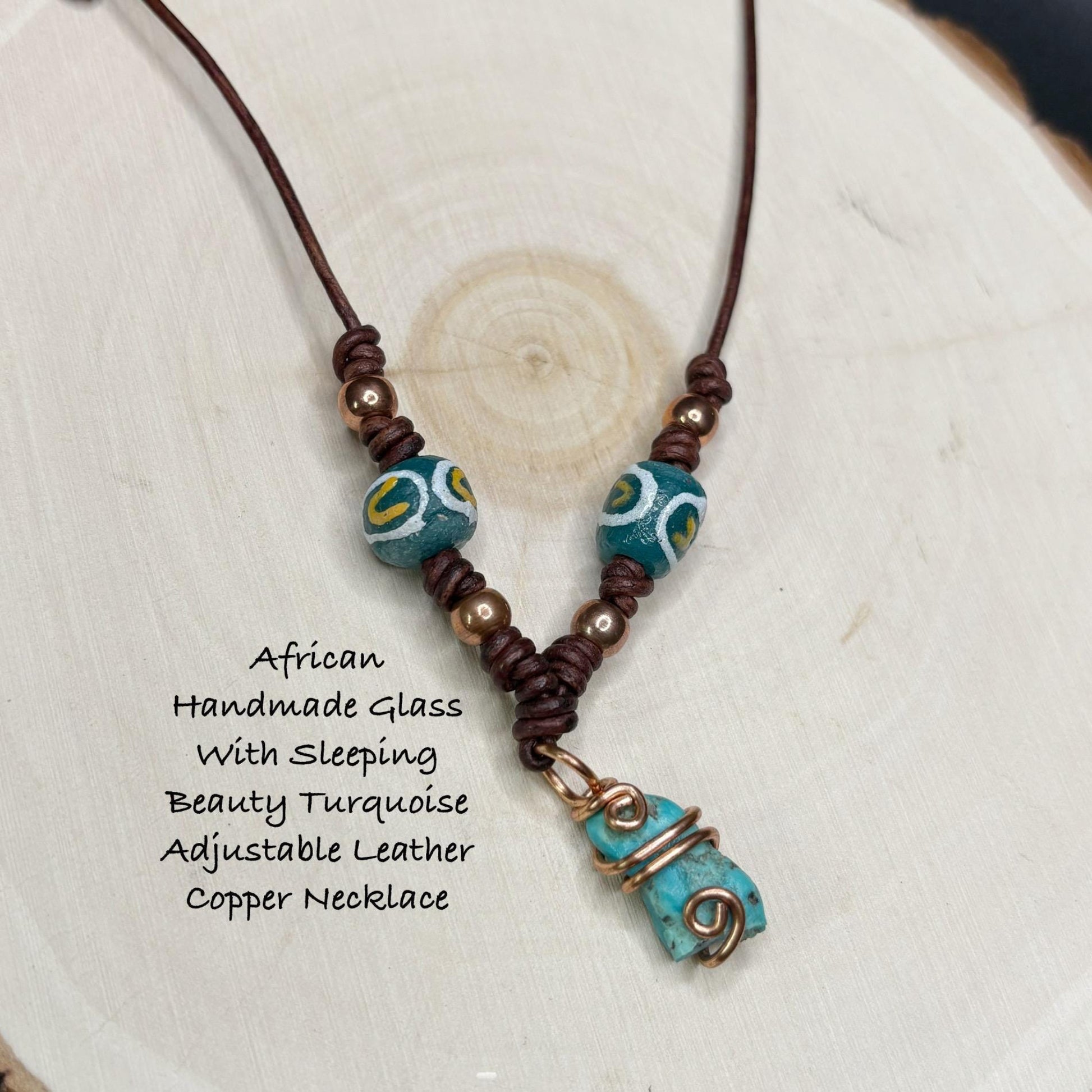 Necklace with turquoise and brown  copper beads on a white background