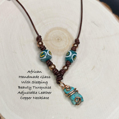 Necklace with turquoise and brown  copper beads on a white background