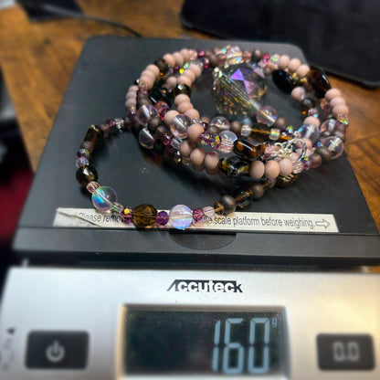 Beaded suncatcher on a digital scale with a visible weight reading.