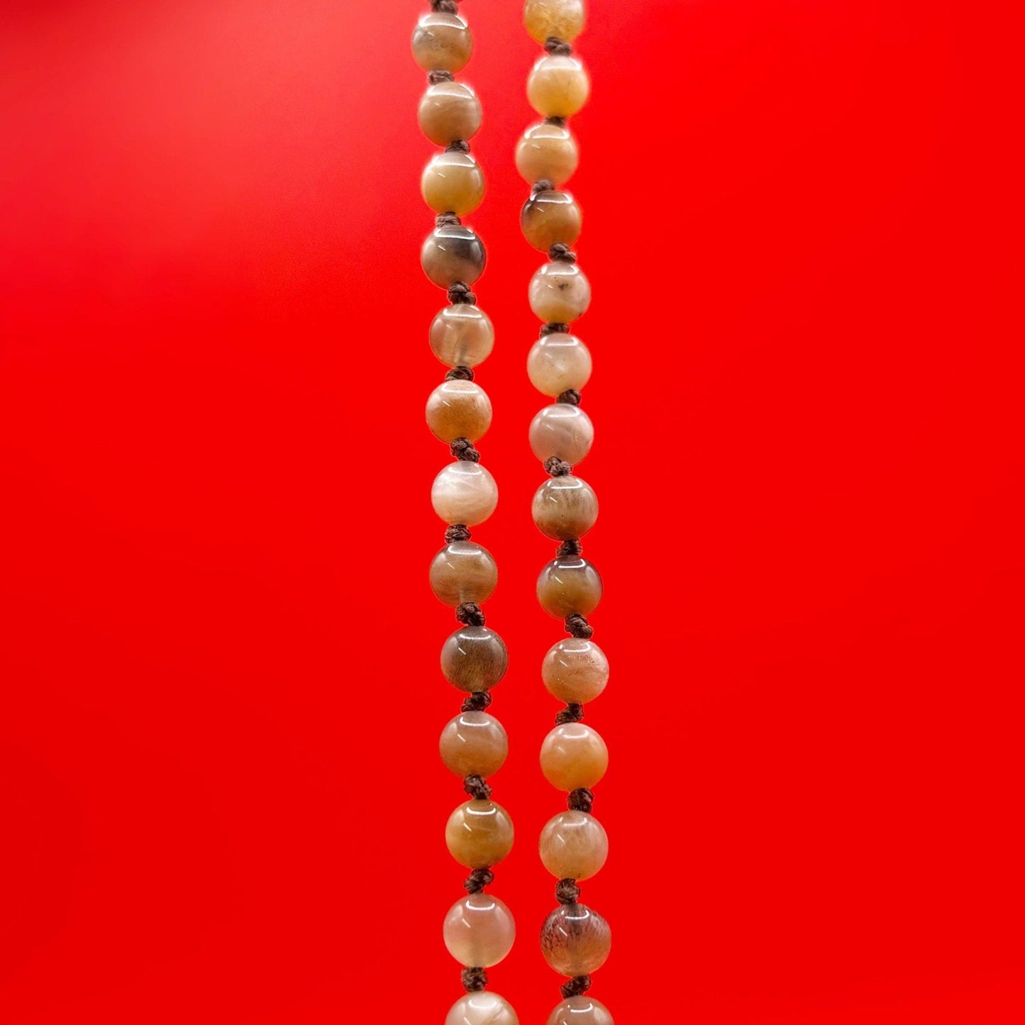 Beaded necklace on a red background