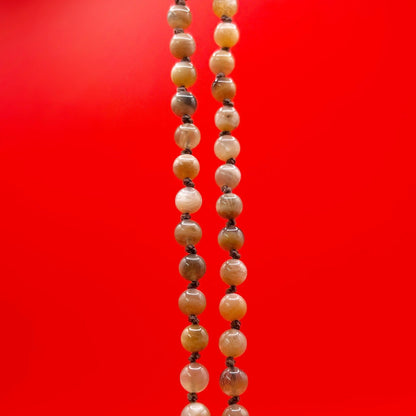 Beaded necklace on a red background