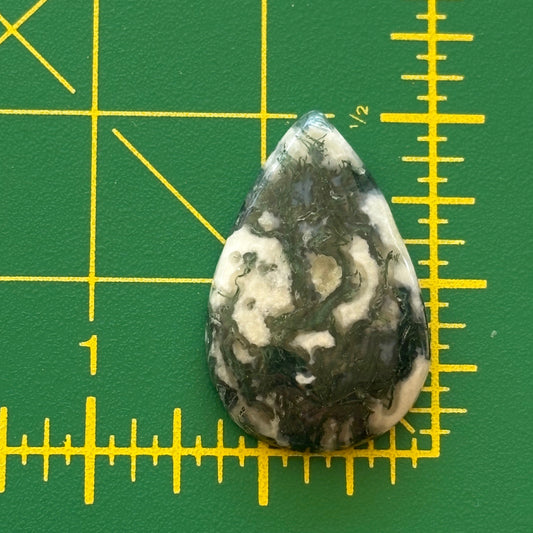 Marbled stone on a green grid background