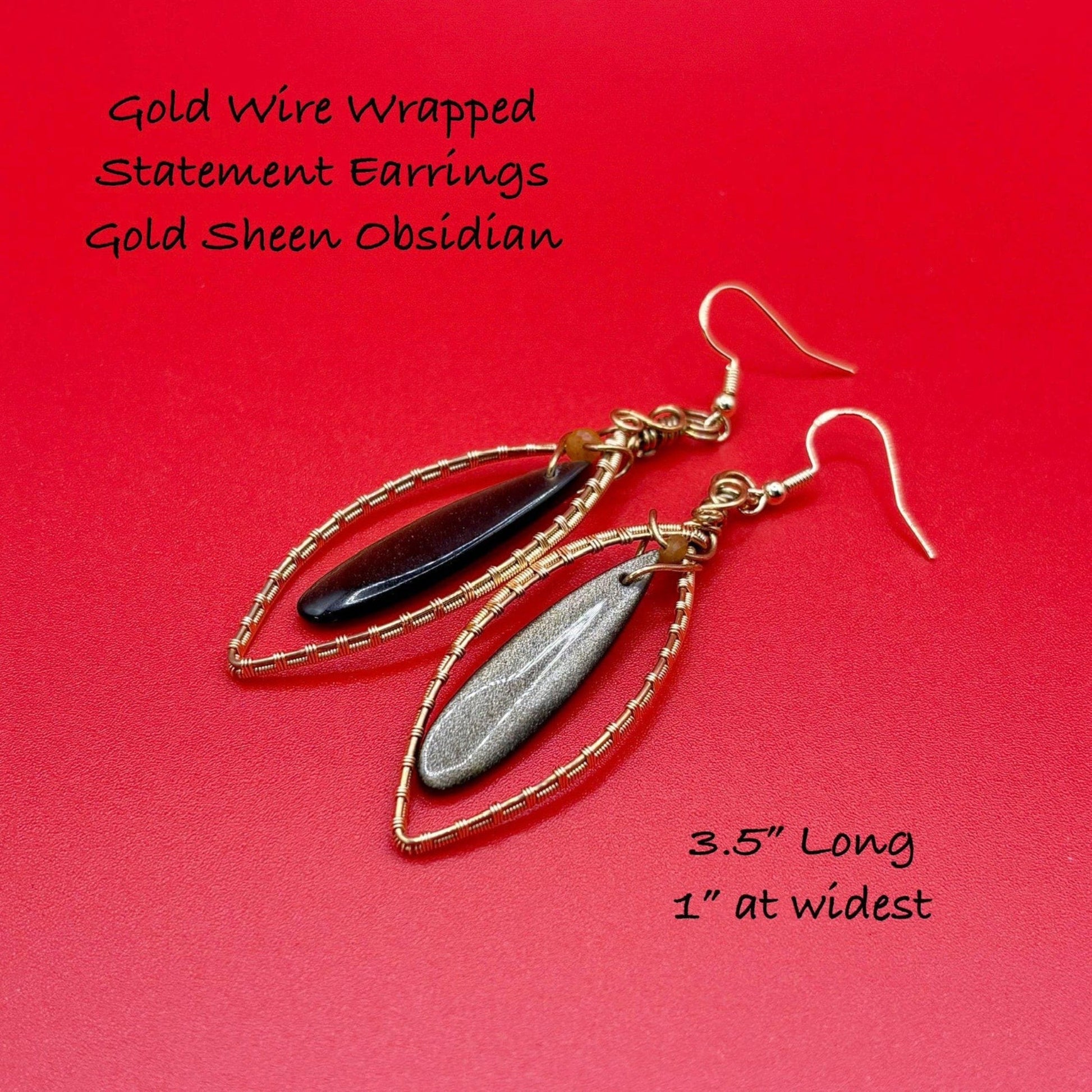 Gold wire wrapped statement earrings with gold sheen obsidian on a red background
