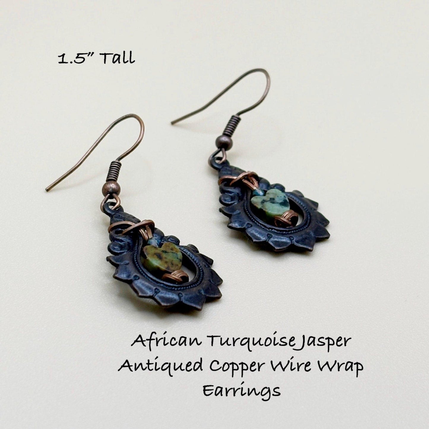 African Turquoise Jasper Antiqued Copper Wire Wrap Earrings on a light gray background