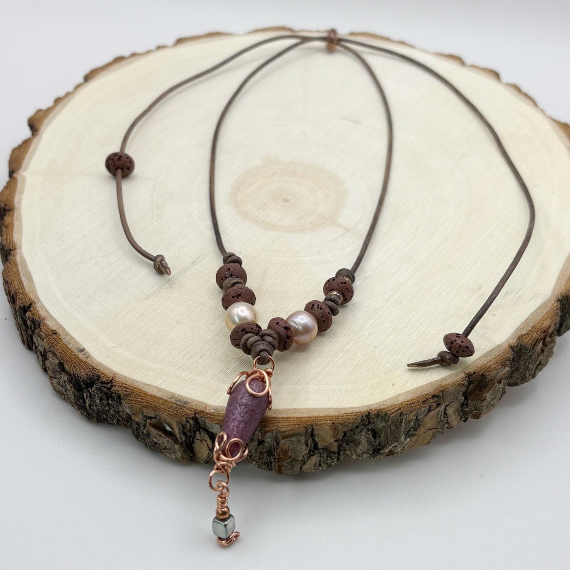 Necklace with beads on a wooden surface