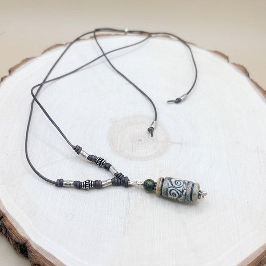 Necklace with beads on a wooden surface