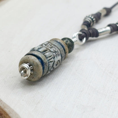 Necklace with decorative beads on a white fabric background