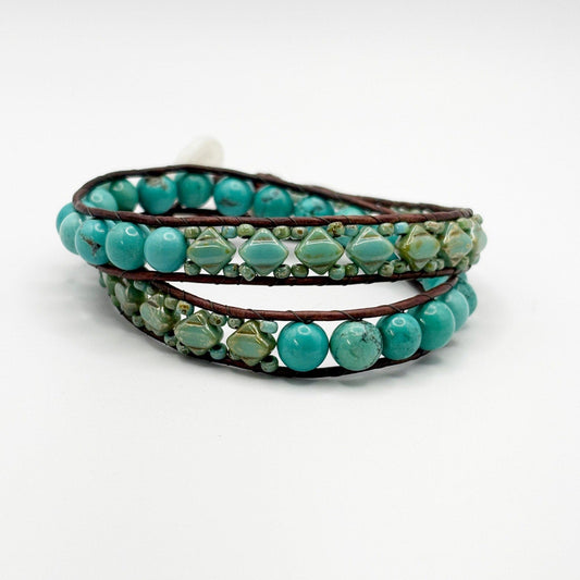 Turquoise beaded wrap bracelet on a white background