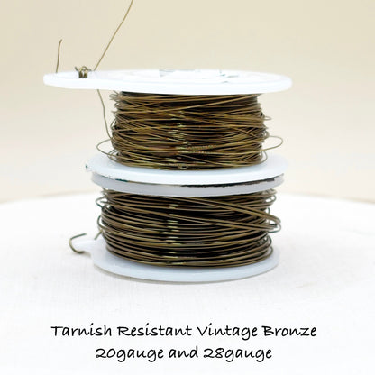 Spool of tarnish-resistant vintage bronze wire on a white background with text indicating gauge.