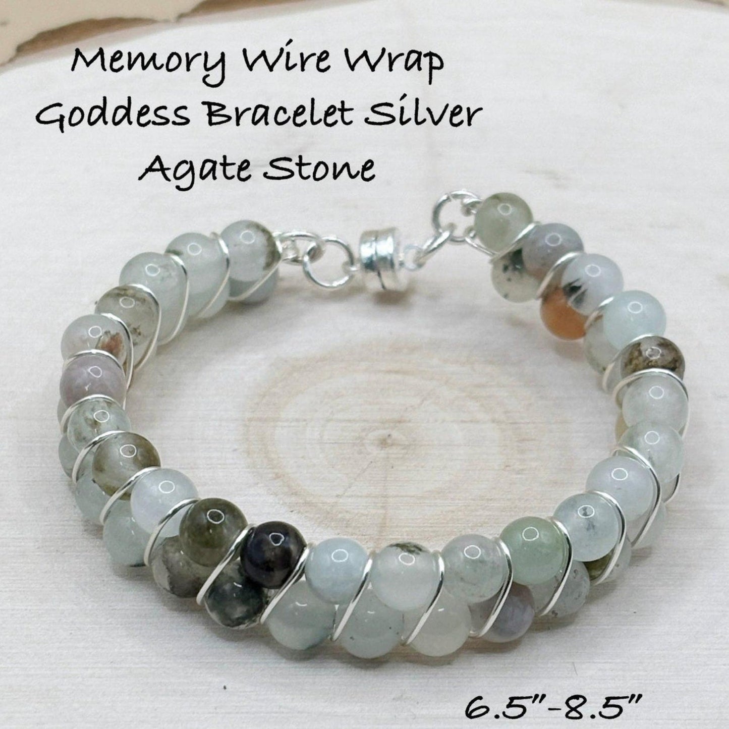 Silver bracelet with blue agate stones on a wooden surface