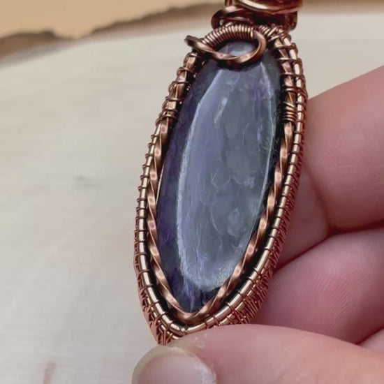 Video of pendant showcasing the stone and woven copper frame