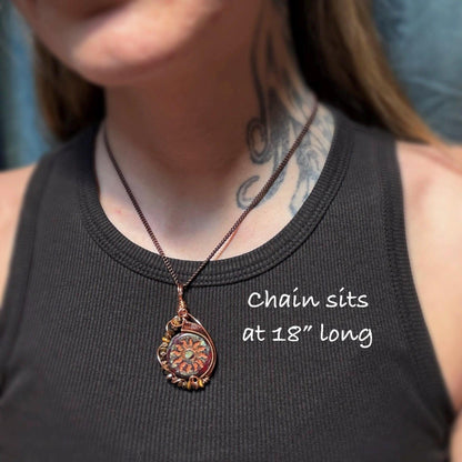 model wearing sunburst necklace showing that the chain is 18 inches long
